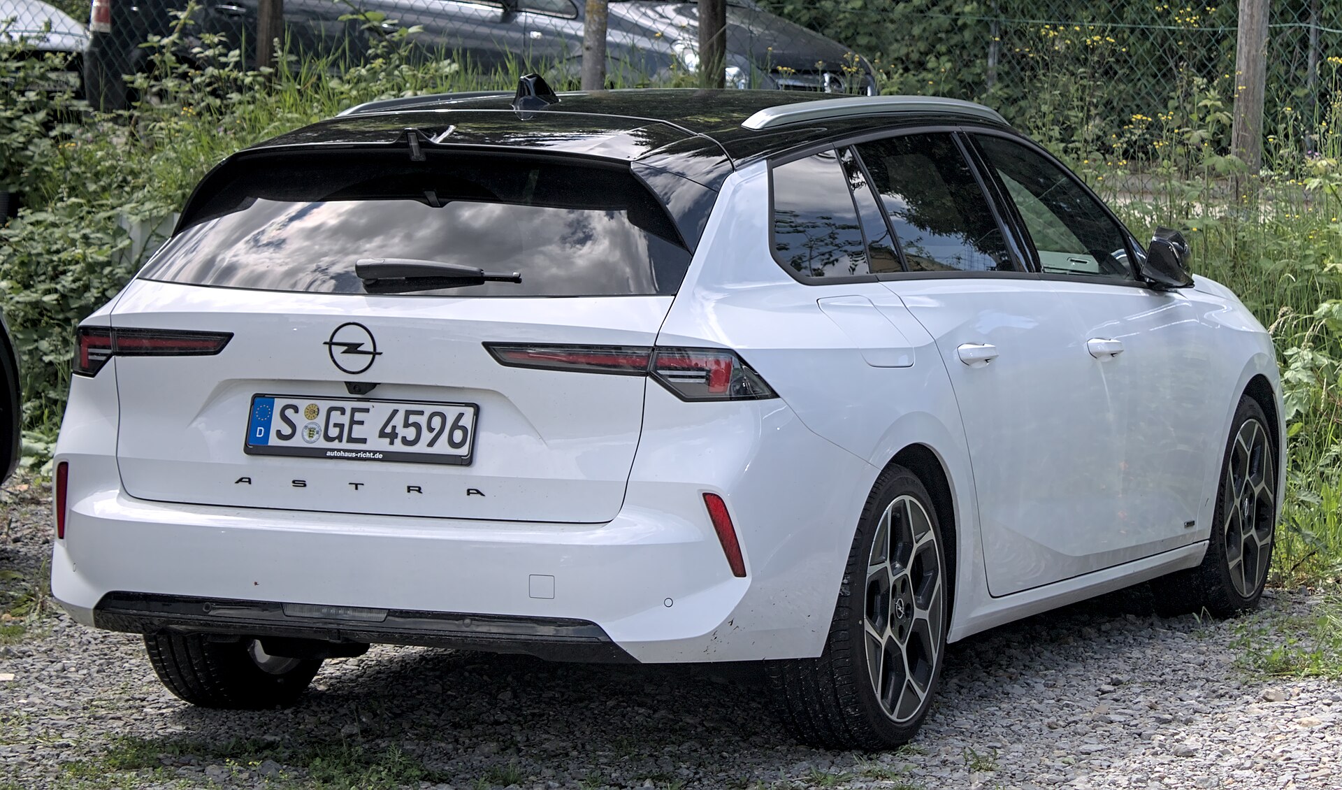 Rear three-quarter view of a white Opel Astra Sports Tourer