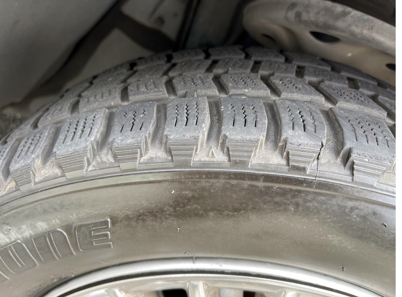 Close-up of tread and sidewall markings on a Bridgestone Blizzak winter tyre