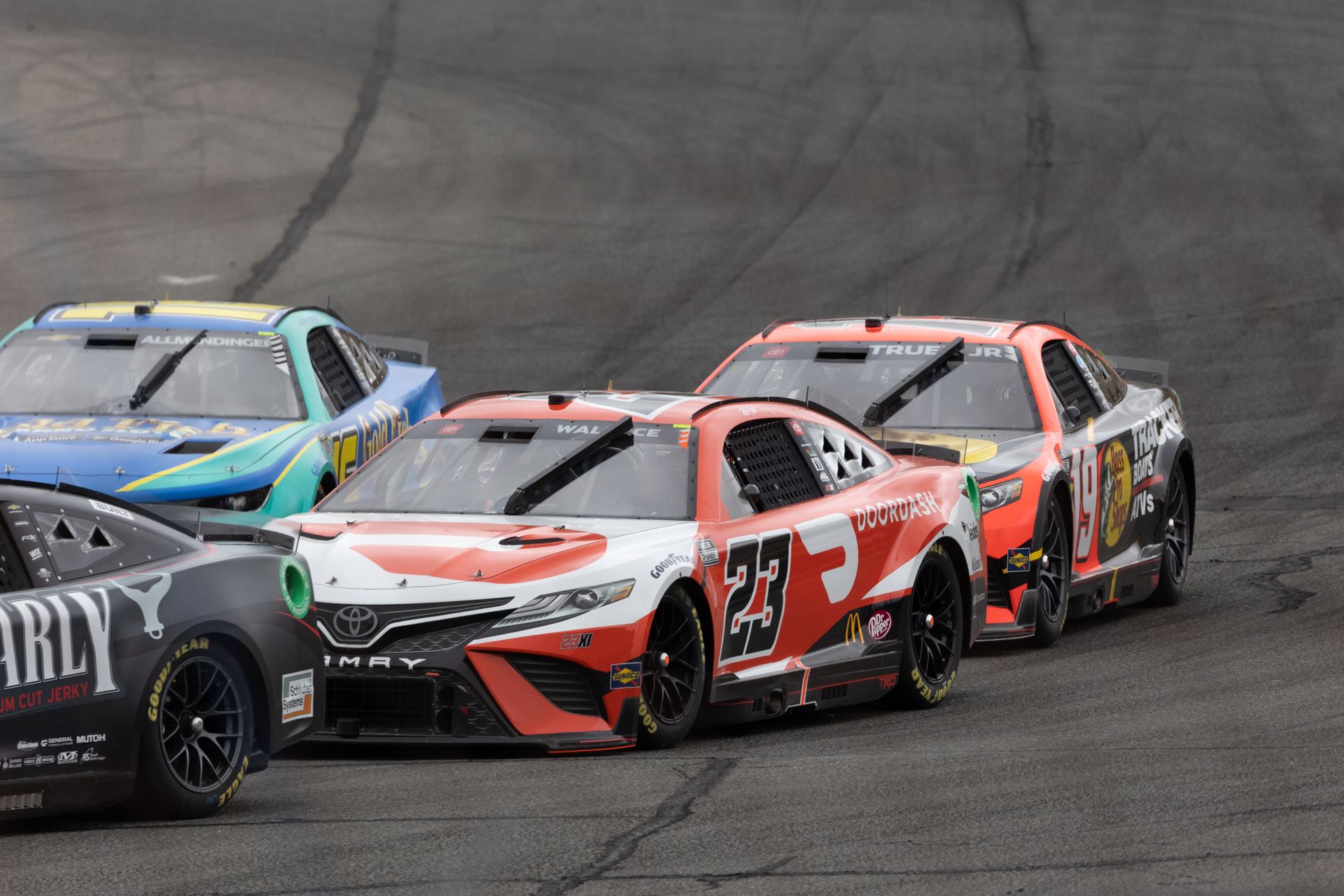 Illustrative: close-quarters stock car racing